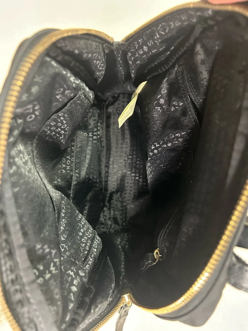 Kate Spade Blake Ave black nylon mini backpack with gold hardware